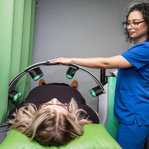 Chinn GYN staff setting up Emerald Laser patient for her session