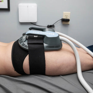 Female patient receiving an Emsculpt NEO treatment on her buttocks at Chinn GYN
